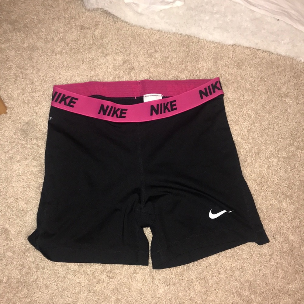 Black and pink Nike pros